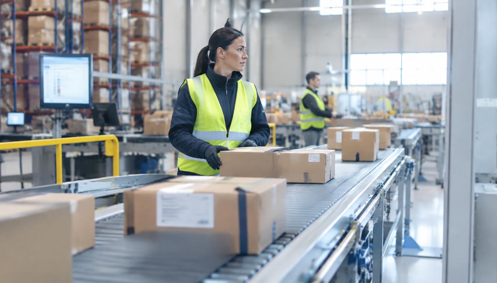 Parcels moving along a conveyor in a fulfilment centre